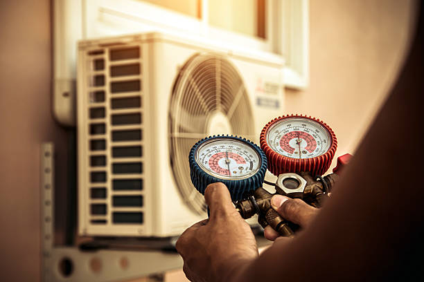 Professional Air Conditioning Service technician working in Suplee, PA